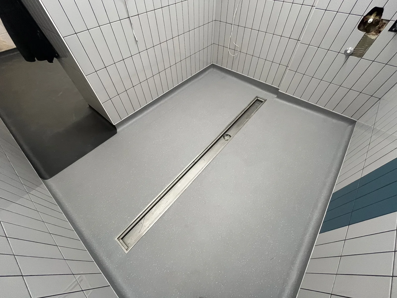 Commercial wet room vinyl flooring repair by UK safety flooring specialists