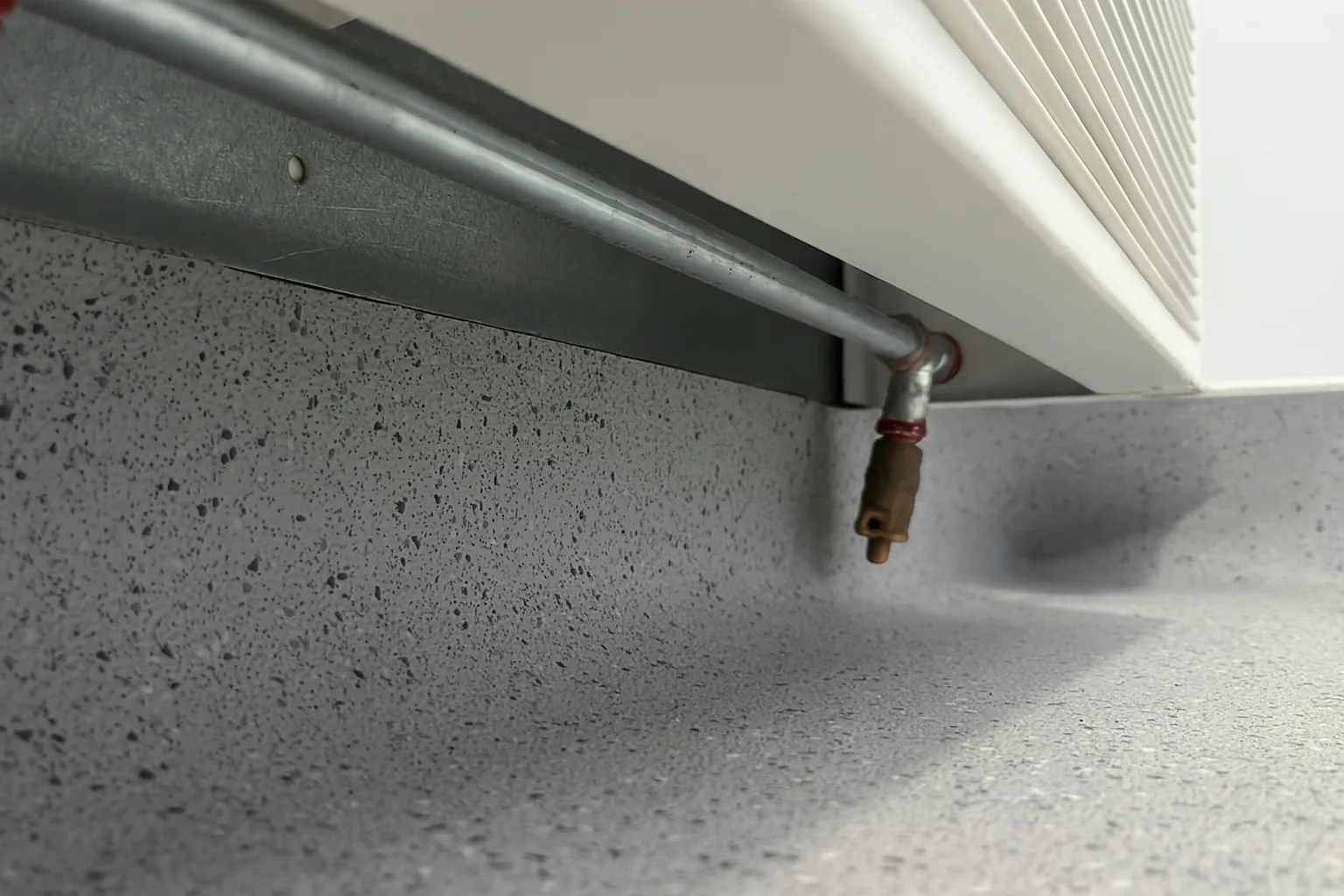 Separated seams in high-traffic sports hallway — invisibly re-welded.